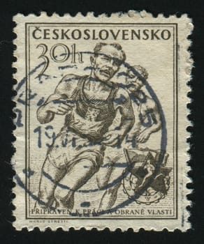 CZECHOSLOVAKIA - CIRCA 1974:  Determined athlete running on remote road, circa 1974.