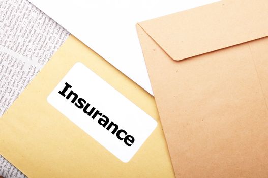 insurance concept with envelope showing risk concept