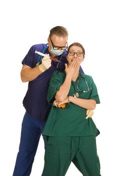 Male doctor injecting saurprised nurse with something,  isolated on white