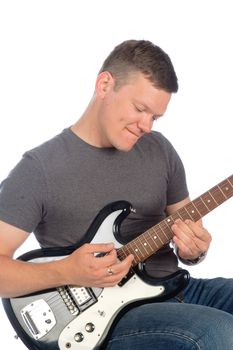 male guitarist playing isolated over white background