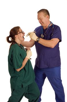 Mad dentist pulling tooth from nurse