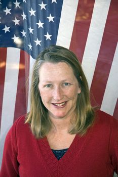 Attractive woman in front of an American flag on inaugaration day