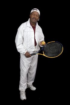 African American active senior citizen tennis player isolated over black background