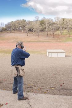 shooter ready for bird on trap house