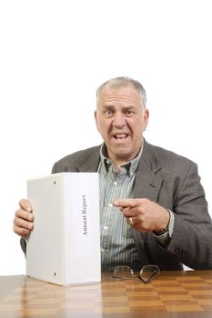 Older businessman in shock after reviewing the annual report