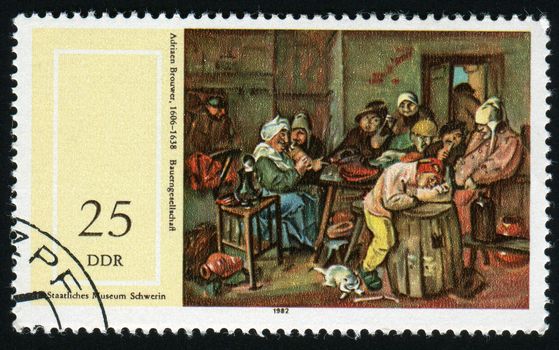 GERMANY  - CIRCA 1982: 17th cent. Paintings in Natl. museum, Schwerin. Farmers Company, by Adriaen Brouwer (1606-1638),  circa 1982.