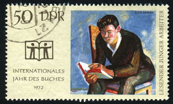 GERMANY  - CIRCA 1972: Young Worker Reading by Jutta Damme,  circa 1972.