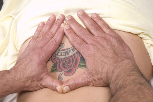 Woman getting a back massage Massage from a masseur