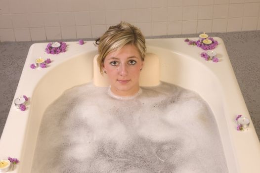 Woman in bath at spa