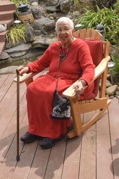Elderly African American Woman sitting in garden