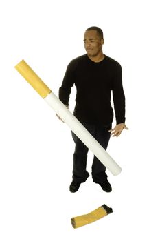 african american man with giant gigarette looking in disgust at filter for an anti smoking campaign