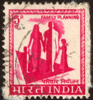 The scanned stamp. The Indian stamp. Family walk. Mother, the father, the son and the daughter.