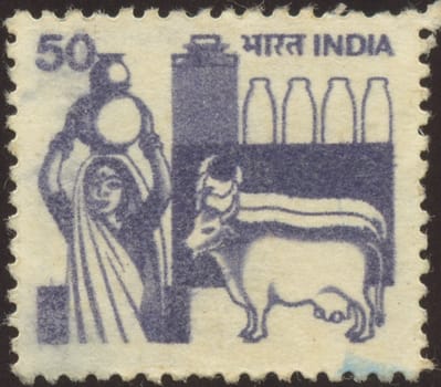 The scanned stamp. The Indian stamp. The woman bears a jug.