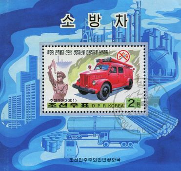 NORTH KOREA - CIRCA 2001: Fire-fighting vehicles and logos warning against specific fire hazards, circa 2001.
