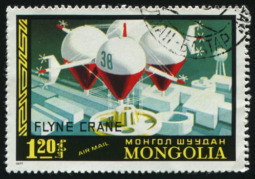 MONGOLIAN - CIRCA 1977: The future spaceship flies over a city, circa 1977.
