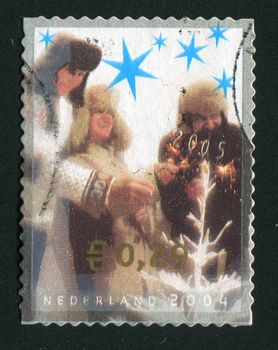 NETHERLANDS - CIRCA 2004: People around Christmas tree, circa 2004.