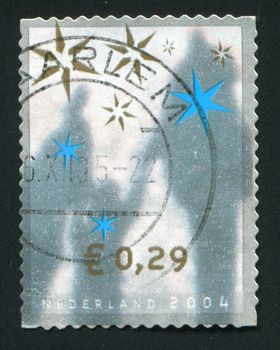 NETHERLANDS - CIRCA 2004: Christmas stamp. Shades of people, circa 2004.