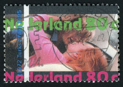 NETHERLANDS - CIRCA 1995: woman and man kissing, circa 1995.