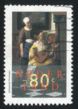 NETHERLANDS - CIRCA 1996: Paintings by Johannes Vermeer. A Lady Writing a Letter, with Her Maid, circa 1996.