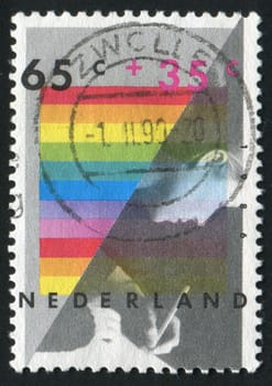 NETHERLANDS - CIRCA 1990: The young woman writes the letter, circa 1990.