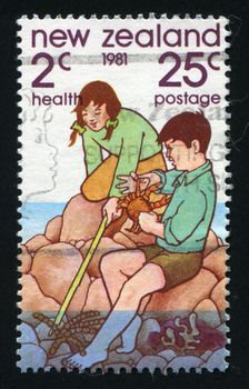 NEW ZEALAND - CIRCA 1981: Boy and girl at Rock Pool, circa 1981.