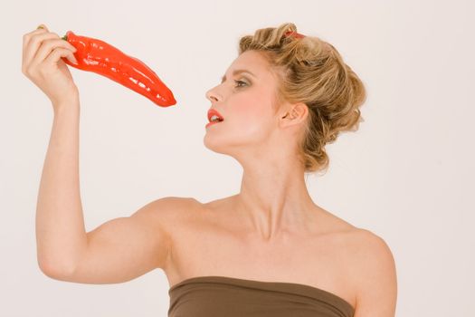 Woman looks sexy in a red pepper