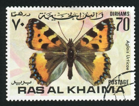 RAS AL KHAIMA - CIRCA 1978: Aglais urticae is a well-known colourful butterfly, found in temperate Europe, circa 1978.