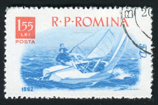 ROMANIA -CIRCA 1962: Sports racing on rowing on a sailboat, circa 1962.