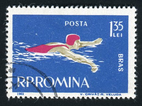 ROMANIA -CIRCA 1963: Sports competitions on a breaststroke, circa 1963.
