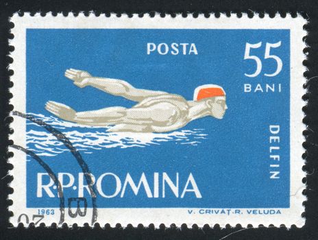 ROMANIA -CIRCA 1963: Sports competitions on a butterflystroke, circa 1963.
