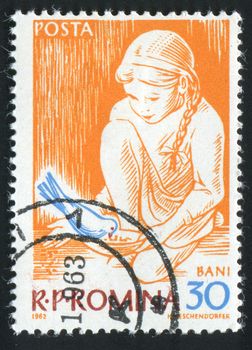 ROMANIA - CIRCA 1962: The girl feeds a bird, circa 1962.