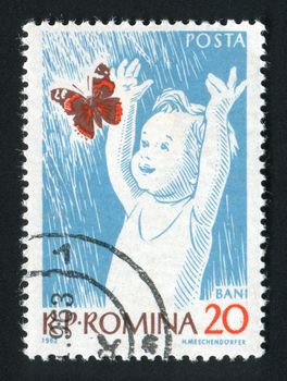 ROMANIA - CIRCA 1962: The kid plays with the butterfly, circa 1962.