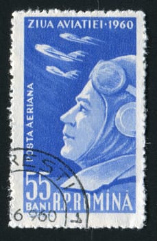 ROMANIA - CIRCA 1960: The military pilot looks in the sky, circa 1960.