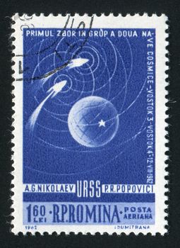 ROMANIA - CIRCA 1962: Space rockets fly round the Earth, circa 1962.