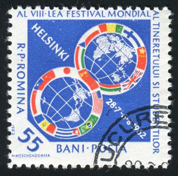 ROMANIA - CIRCA 1962: 8th Youth Festival for Peace and Friendship Helsinki, July 28-Aug. 6. Globes Surrounded with Flags, circa 1962.