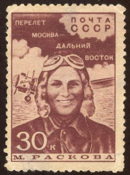 The scanned stamp. The Soviet stamp. The woman the officer, the military pilot.