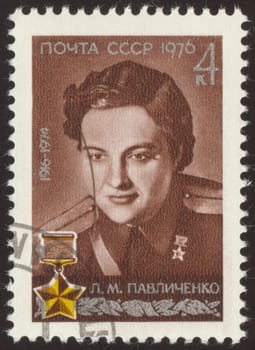 The scanned stamp. The Soviet stamp. The woman the officer, the military pilot.