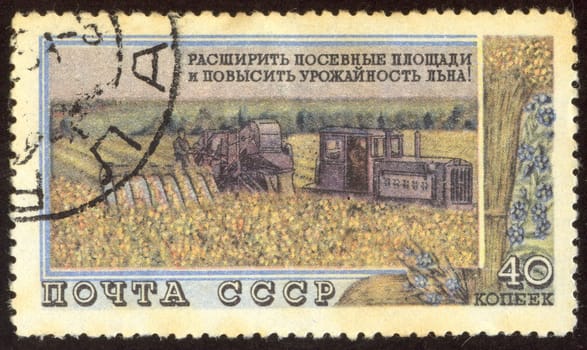The scanned stamp. The Soviet stamp. Collective farmers plough a field.