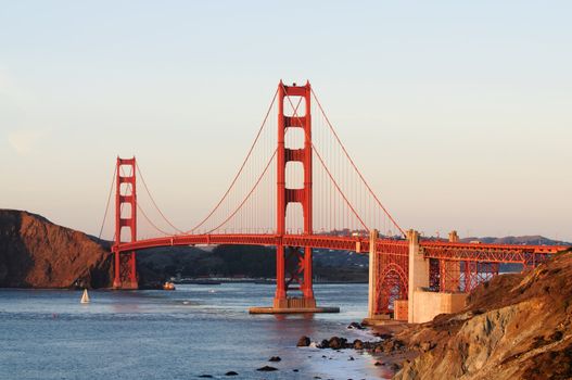 Golden Gate Bridge from Bakers Beach area in San Francisco at sunset