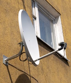 The satellite aerial on a house wall in the city of Kaliningrad.