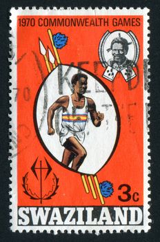 SWAZILAND - CIRCA 1970:  Walking Racer Shield and king, circa 1970.