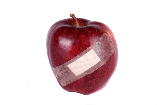 A metaphorical image of an apple wounded due to genetical modification.