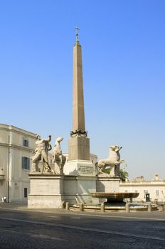 Column, statue and fountain in the Quarinale, in Rome