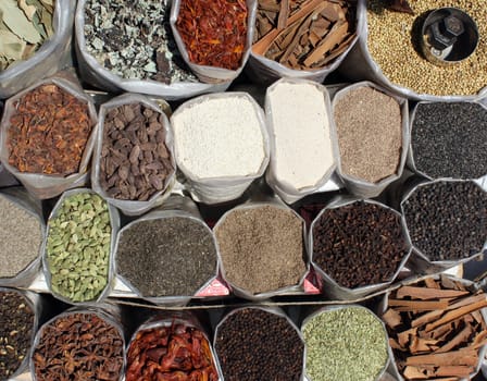 A background of various spices at at Indian shop.