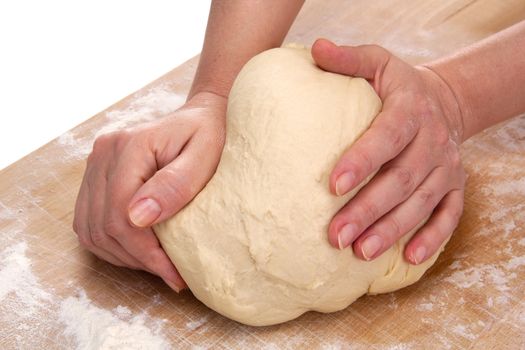 Women's hands kneading dough for baking

