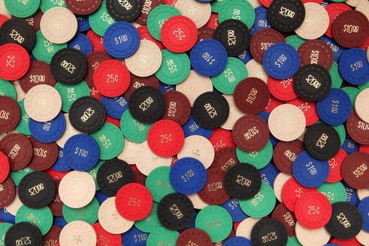 Photo of generic antique poker chips as a background.