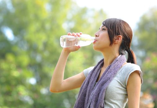 woman drink water after sport