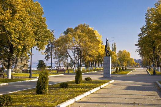 City Quay in the fall. Emptiness. Monument in the background and orange trees.