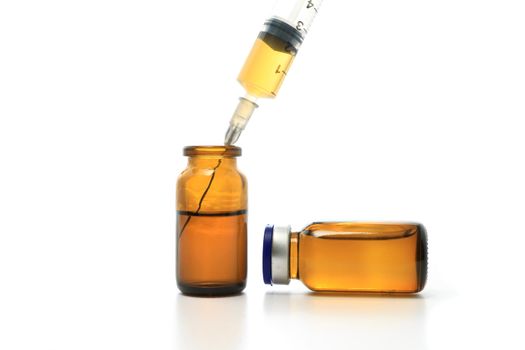 Syringe, glass bottles with drugs isolated on white