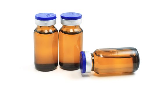 three glass bottles with medicine on white background